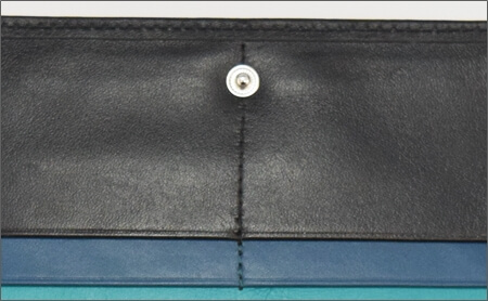 JOGGO（ジョッゴ）の財布の実物の縫製拡大写真　歪んでいる箇所